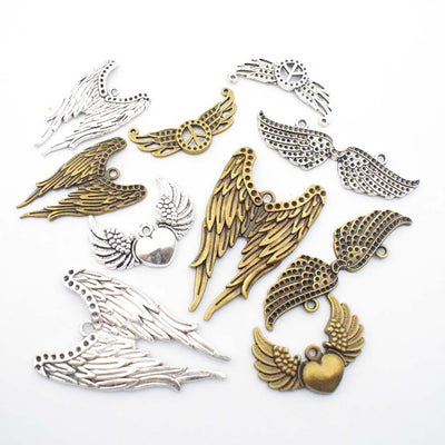 Gold-tone seashell charms arranged on a light background