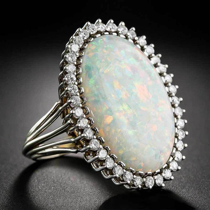 Opalescent Oval Cabochon Halo Ring In Polished Silver Tone