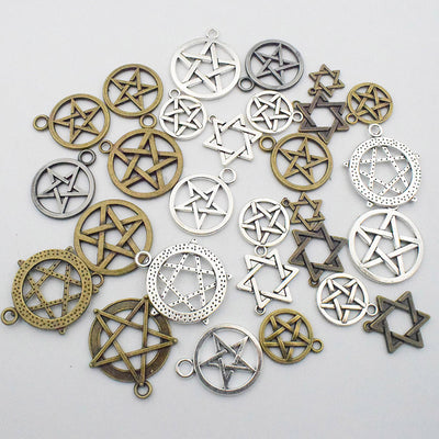 Metallic assorted shape charms arranged on a light background