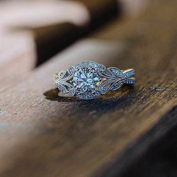 Silver Round Stone Leaf Halo Ring In A Polished Decorative Design