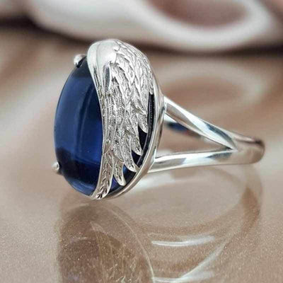 Silver-Tone Blue Cabochon Ring With Sculpted Wing Setting shown in front product view