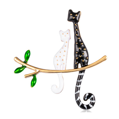 Front product view of the cat brooch pin in silver and gold