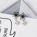 Black Outline Flower and White Pearl Look Drop Earrings view 1
