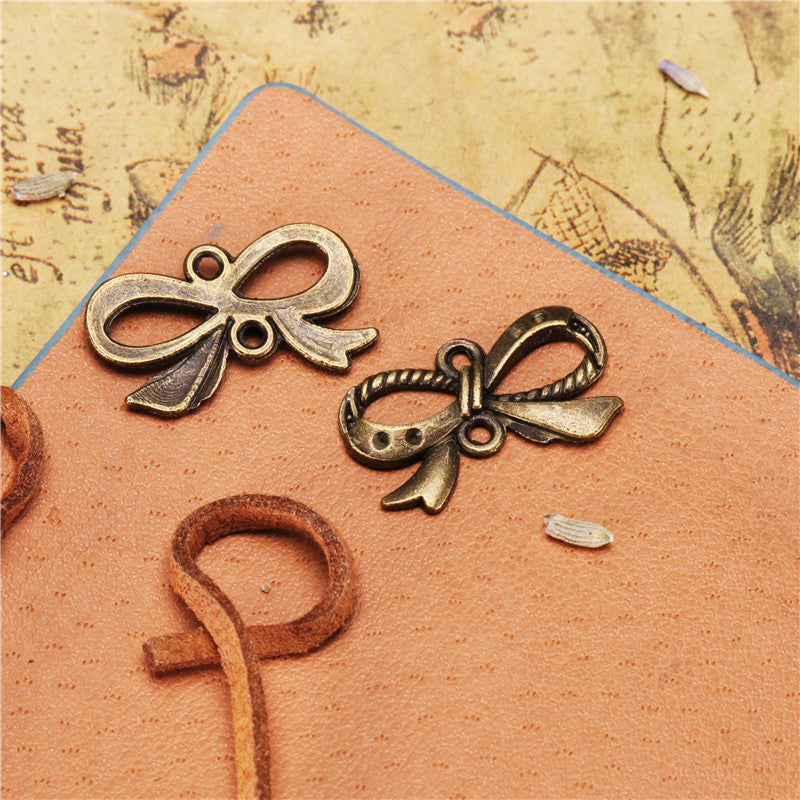 Alloy Bow Connector Charm with Top and Bottom Holes 23x13mm