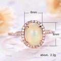 Rose Gold Tone Oval Opalescent Halo Ring In A Polished Decorative Design view 5