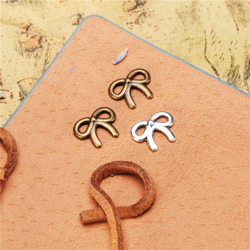 Gallery view of the tiny bow embellishment showing its overall shape