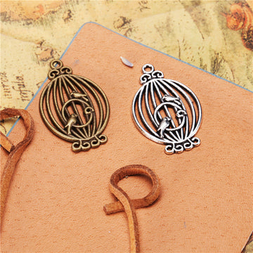 Open Birdcage and Bird Metal Pendants in Bronze and Silver Tones