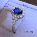 Deep Blue Oval Solitaire Floral Cluster Ring Silver Tone view 5