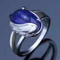 Silver-Tone Blue Cabochon Ring With Sculpted Wing Setting view 3