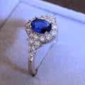 Deep Blue Oval Solitaire Floral Cluster Ring Silver Tone view 3