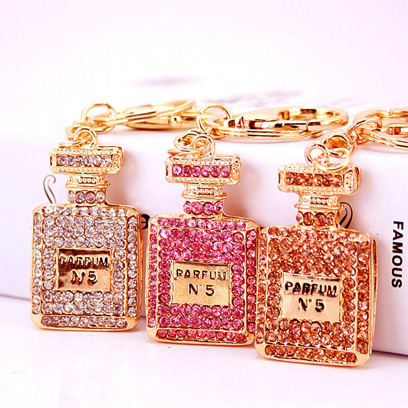 Rhinestone Perfume Bottle Keychain with Four Leaf Clover Metal Bag Charm