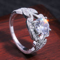 Silver Round Stone Leaf Halo Ring In A Polished Decorative Design view 4