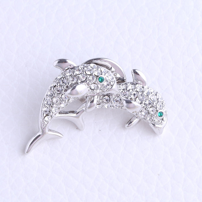 Pair of Rhinestone Dolphin Brooches with Pale Aqua Accents