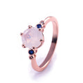 Rose Gold Tone Pink Oval Ring With Blue Side Stones view 6