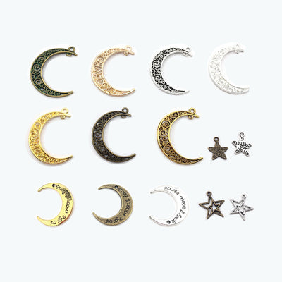 Gold-tone moon charms arranged on a light background