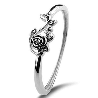 Silver rose flower vine thin band ring on white background