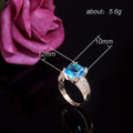 Aqua Blue Rectangular Stone Ring With Gold Tone Pavé Band view 5