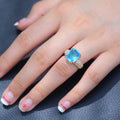 Aqua Blue Rectangular Stone Ring With Gold Tone Pavé Band view 4