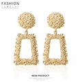 Gold and Silver Textured Round Trapezoid Dangle Earrings view 1