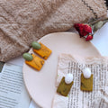 Gold Tone Olive Green Oval And Amber Rectangle Stud Earrings view 1