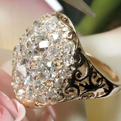 Product view showing gold-tone filigree floral cluster ring