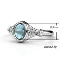 Silver Tone Scroll Ring with Pale Blue Oval Cabochon view 5