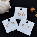 Gold Asymmetric Star Moon Planet Zircon Stud Earrings view 1