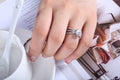 Triple Row Crossover Ring With Round Clear Center Stone view 2