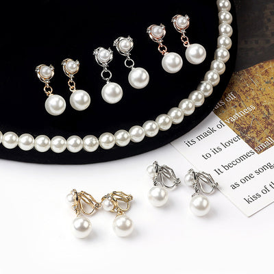 Primary supplied view of pearl-look ball stud and clip earrings