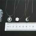 Clear Faceted Teardrop Crystal Pendant on an Invisible Cord Necklace view 2