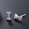 Silver Tone Clear Stone Bow Stud Earrings Polished Metal Jewelry view 1