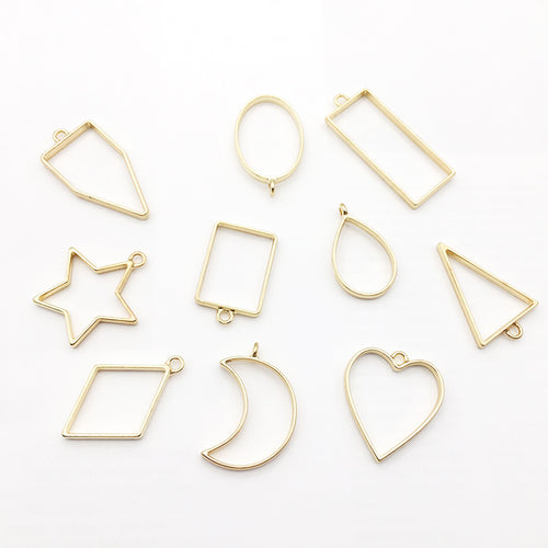 Metallic assorted shape charms shown in a close-up product view