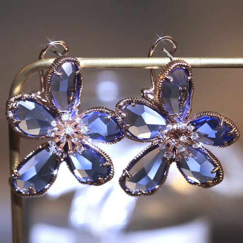 Five Petal Crystal Flower Drop Earrings styled close-up