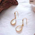 Gold Tone Shell Pattern Teardrop Hook Earrings In Black And White view 7