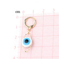 Gold Tone Blue Evil Eye Huggie Drop Earrings with Marquise Frame view 2