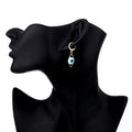 Gold Tone Blue Evil Eye Huggie Drop Earrings with Marquise Frame view 4