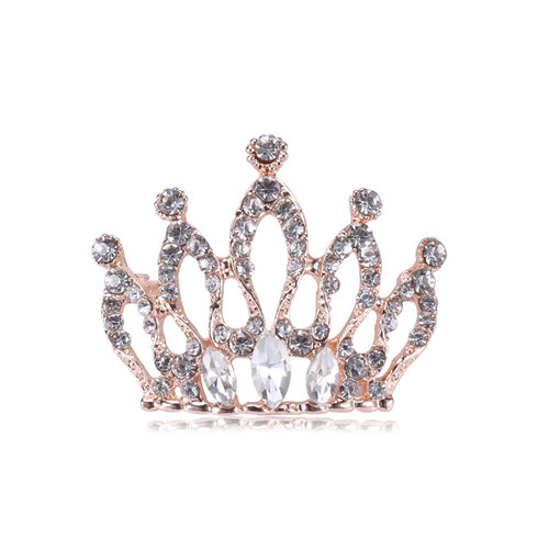 Rose gold rhinestone crown brooch front on white