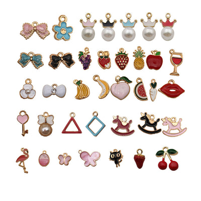 Gold-tone bird charms arranged on a light background