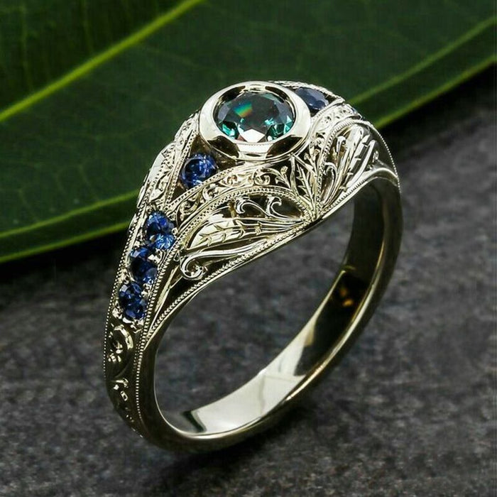 Opalescent Oval Blue Stone Filigree Ring In Two Metal Tones