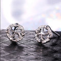 Silver Tone Pinwheel Stud Earrings with Clear Stones view 1