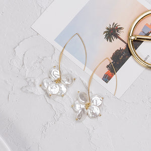 Long Gold-Tone U-Wire Drop Earrings with White Petal Clusters
