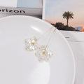 Long Gold U Wire and White Pearl Look Petal Earrings view 2