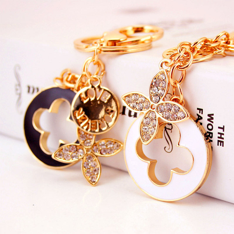Rhinestone Perfume Bottle Keychain with Four Leaf Clover Metal Bag Charm
