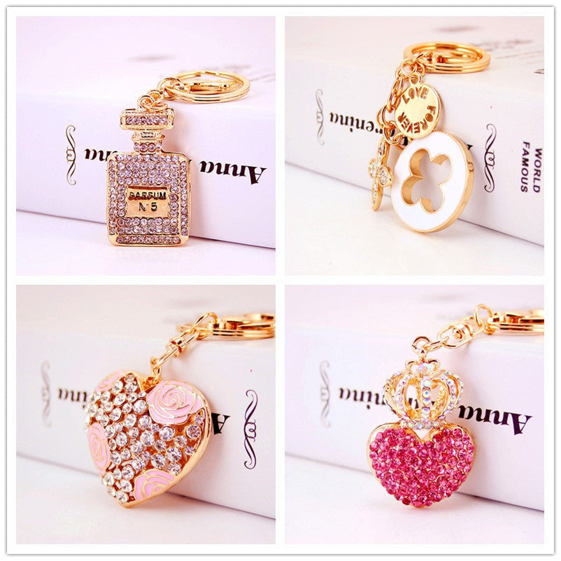 Rhinestone Perfume Bottle Keychain with Four Leaf Clover Metal Bag Charm