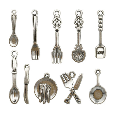Antique silver assorted shape charms arranged on a light background