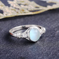Silver Tone Scroll Ring with Pale Blue Oval Cabochon view 6