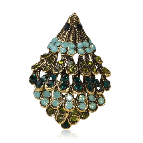 Front view of the layered crystal hedgehog brooch in antique gold and silver brooch and its color options