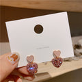 Geometric Crystal Stud Earrings with Sparkling Stone Details view 1
