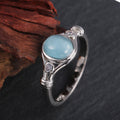 Silver Tone Scroll Ring with Pale Blue Oval Cabochon view 2