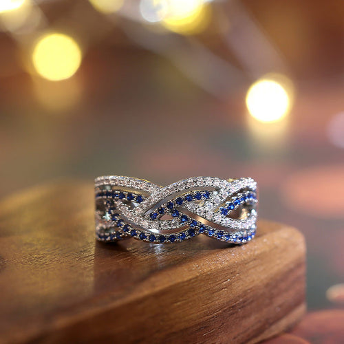 Blue and Clear Pavé Stone Interwoven Wide Band Ring shown in alternate angle